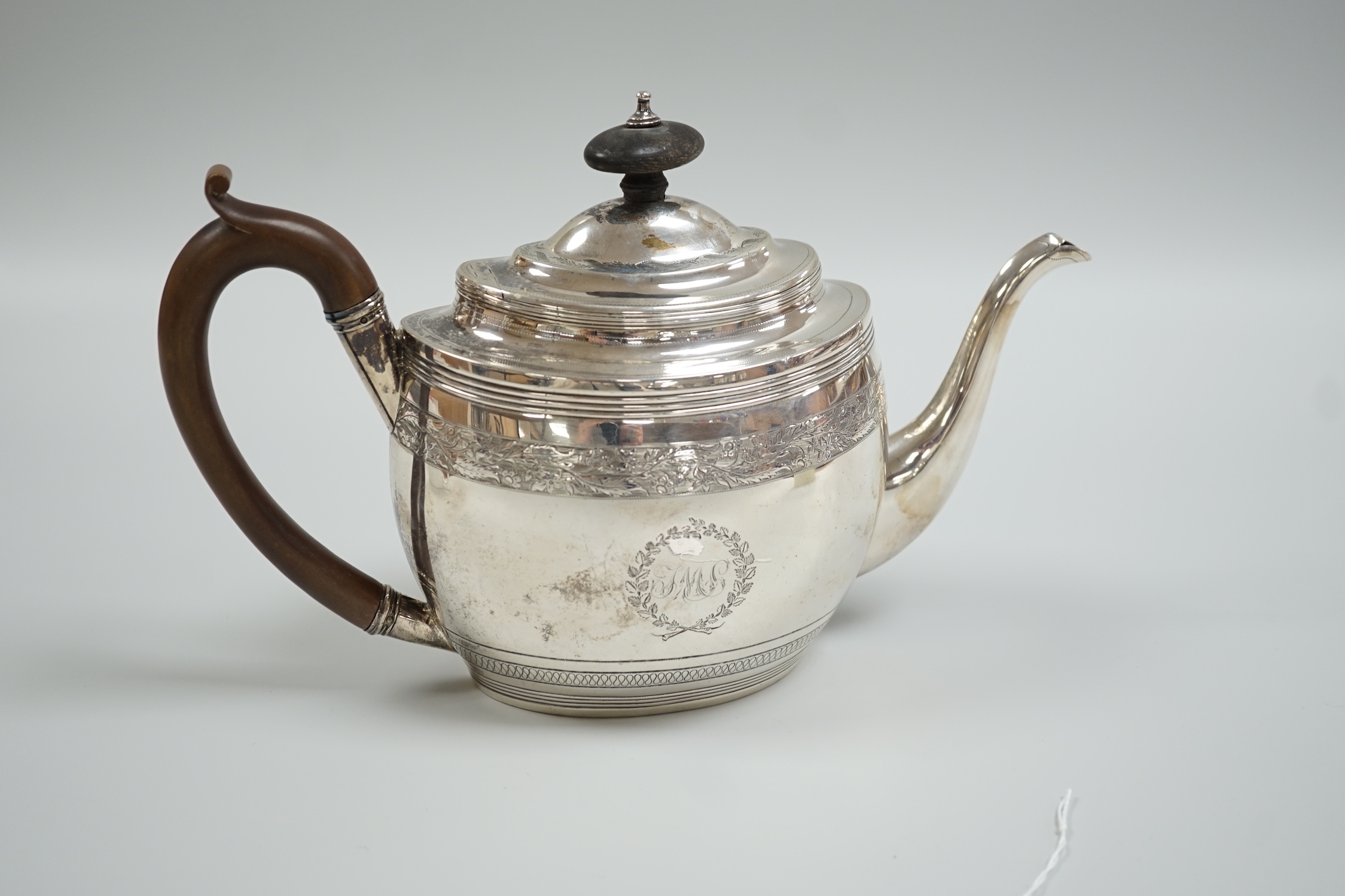 A George III engraved silver oval teapot, Thomas Wallis II?, London, 1802, gross weight 15.5oz.